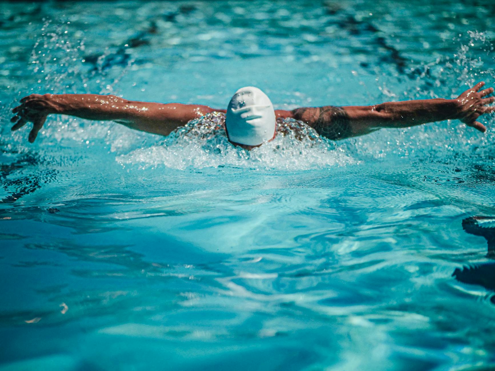 a swimmer doing the butterfly stroke